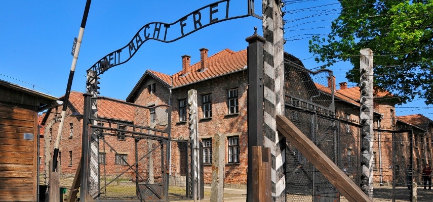The preserved guard tower and railway entrance of Auschwitz II-Birkenau memorial site.
