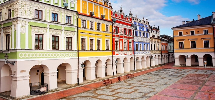 The arcaded Renaissance townhouses and Town Hall tower on the Great Market Square in Zamość.